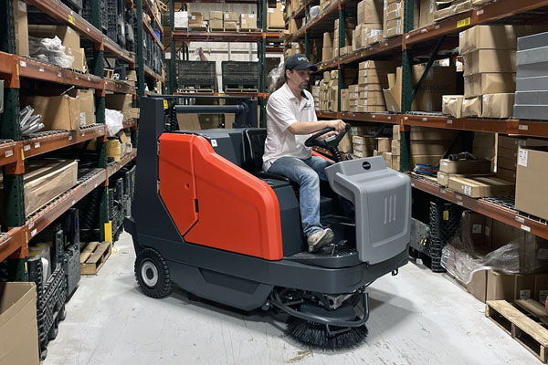 Powerboss Sweepmaster in warehouse aisle